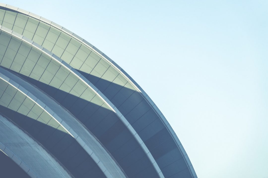 Construction company Dhaka Bangladesh — modern curved commercial building facade showing architecture and construction quality — House De Arch EPC integrated delivery