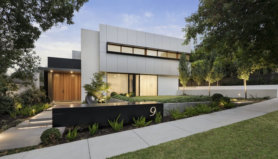 Contemporary modern house exterior with clean lines, large windows and landscaped setting — premium residential interior design Bashundhara Dhaka Bangladesh