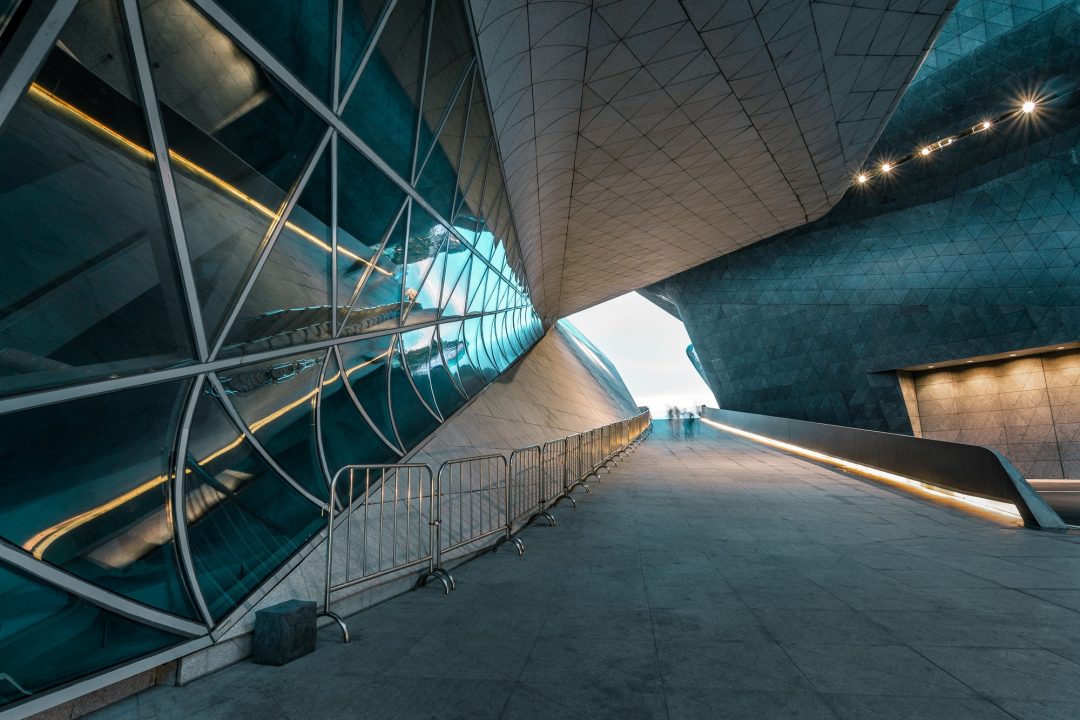Modern commercial office building exterior with glass facade — office fit-out cost guide Bangladesh 2025
