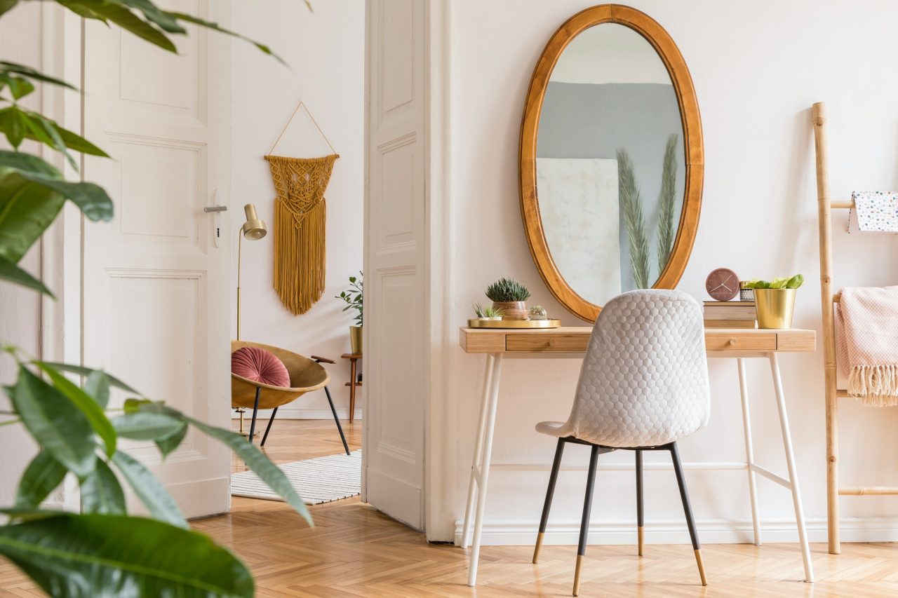 Stylish minimalist bedroom with dressing table, oval mirror, velvet chair and natural materials — wardrobe and bedroom storage design Bangladesh